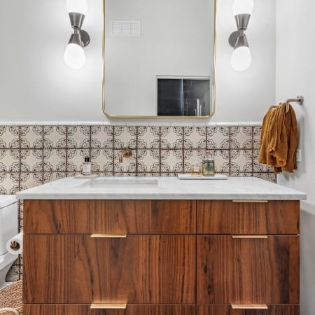 Asymmetrical Vanity Drawers with Gold Pulls