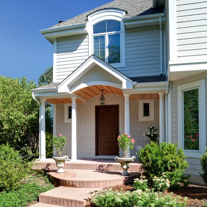 Front Portico with White Trim and Pillars