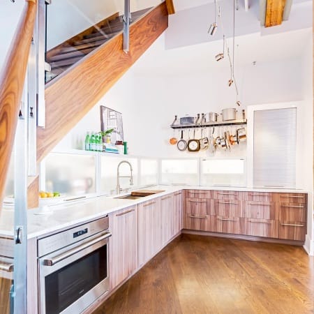 Exposed Beams with Modern Staircase Railings to Match