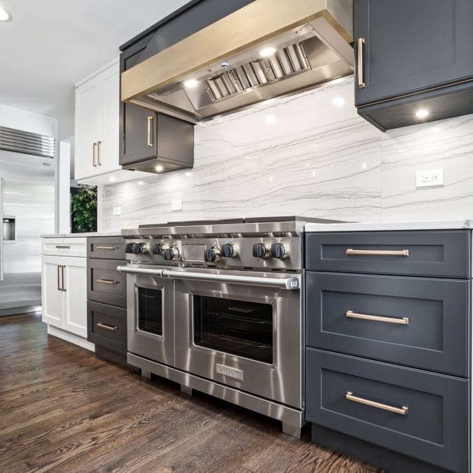 White and Black Shaker Cabinets with Brushed Brass Finish