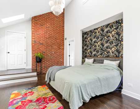 Bedroom with Custom Cut-Out and Exposed Brick