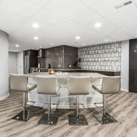 Modern Basement Featuring Luxury Vinyl Tile and a Fireplace
