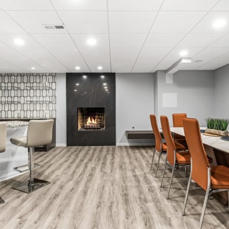 Dining and Kitchen Seating Adjacent to Wood Burning Fireplace