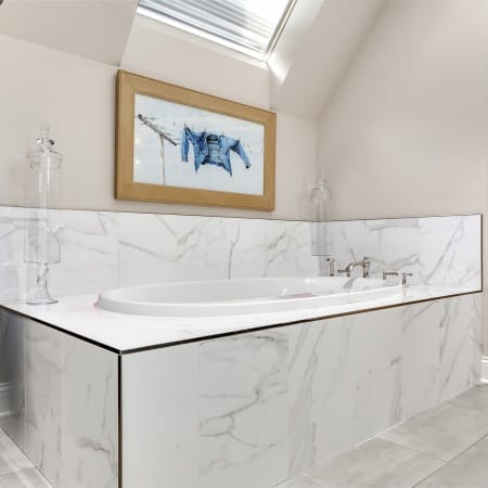 Quartz Lined Soaking Tub with Vertical Blue Cabintery