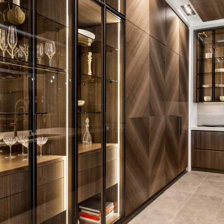 Illuminated shelves with glass-front cabinet doors