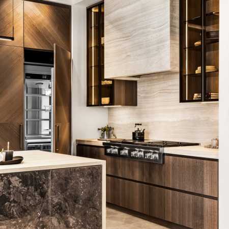 Neolith stone fume hood with professional range top, panel front refrigerator