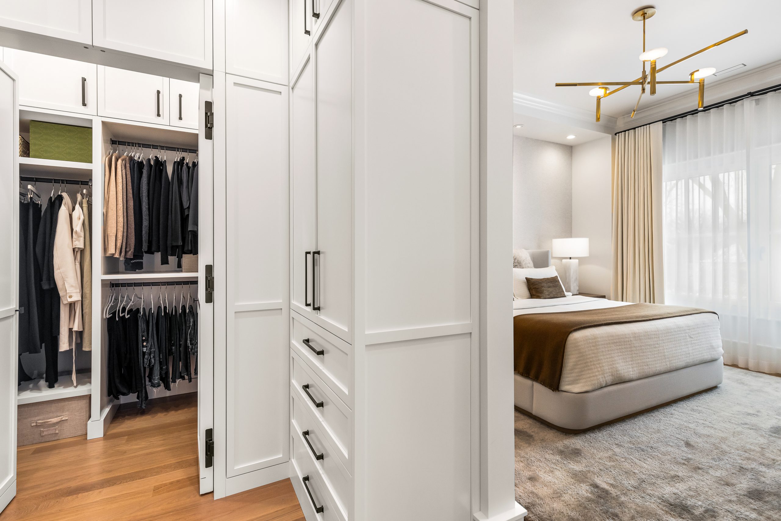 Remodeled walk-in closet with built-in shelving.